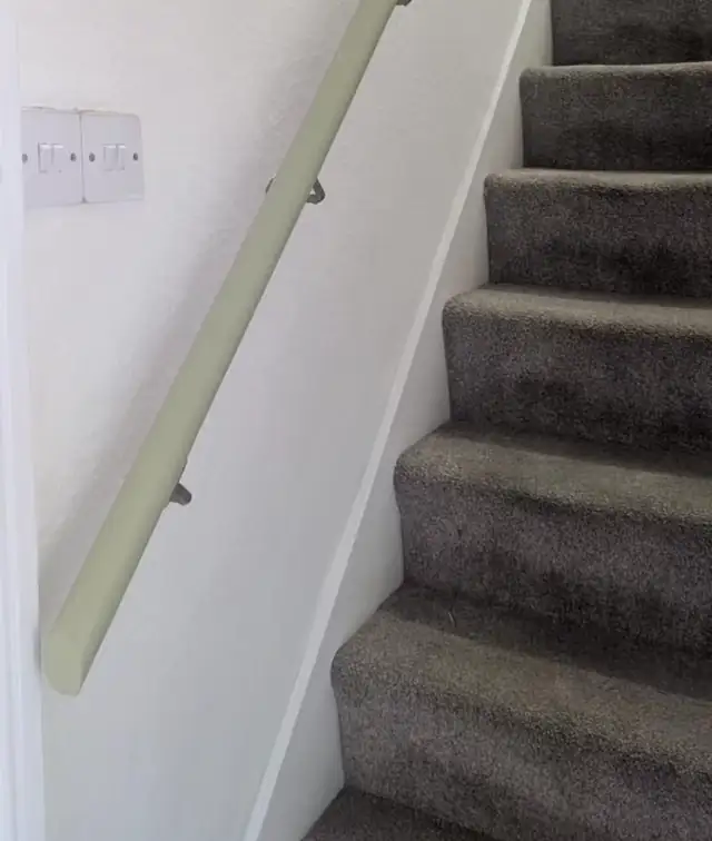 Staircase with freshly painted walls and handrail